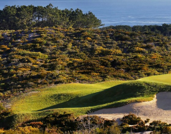 <p>As you arrive at this stunning location around an hours drive north of Portugal's capital city, Lisbon, you immediately know you are in for an incredible round of golf. As you near the course the road gives way to stunning sand dunes and clifftops that break into the Atlantic Ocean. A buggy is a must here unless you are a mountain goat and the first few holes encircle the first, and largest, of 3 lakes. You couldn't really call the course a traditional links course although holes 6 through 8 and 10 through 12 are as close as you can get without being on the beach itself and the wind can cause all kinds of challenges for those who are not used to links golf play.</p>
<p>If you keep it straight and low in the wind the front 9 can leave you with a warm fuzzy feeling and the scenery is stunning. The back 9 plays away from the beach and can give your drives a real helping hand, which comes as a blessing on the long 13th, the back 9 also offers an extra hazard of brush between the tee and fairway so you need to make sure you're hitting the target as if you find yourself in the light sand and dense gorse bushes, finding your ball will be the least of your worries.</p>