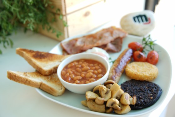 Our legendary English breakfast is served with English Lincolnshire Sausage, English Smoked Bacon, Heinz Beans, a Hash Brown, Fresh Mushrooms, Hot Buttered Toast and a choice of Poached, Scrambled or Fried Egg. We have extras that can be added including Black Pudding, White Pudding and grilled Vine tomatoes.