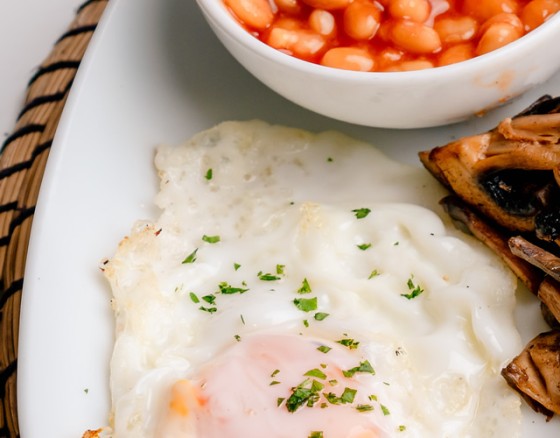 Our legendary English breakfast is served with English Lincolnshire Sausage, English Smoked Bacon, Heinz Beans, a Hash Brown, Fresh Mushrooms, Hot Buttered Toast and a choice of Poached, Scrambled or Fried Egg. We have extras that can be added including Black Pudding, White Pudding and grilled Vine tomatoes.