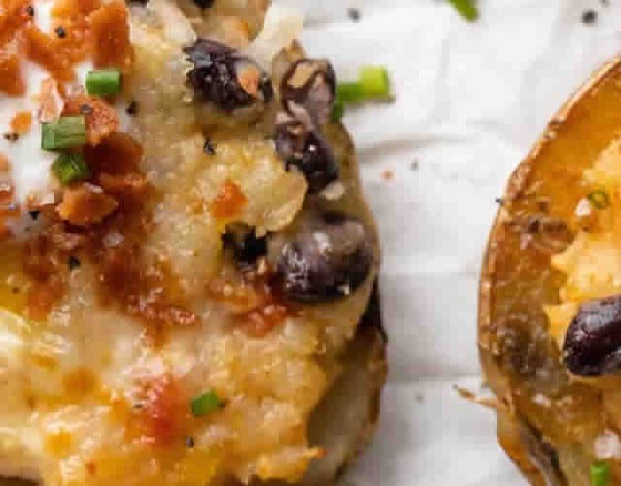 Freshly baked potatoes, the fluffy mash is scooped out and blended with cream cheese, butter and chives, the skins are oven-baked and then stuffed with the mash, topped with mature cheddar and grilled.